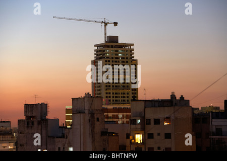construction of new apartment tower block and rooftops in the evening buenos aires argentina Stock Photo