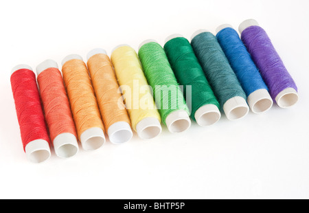 rainbow color spools threads isolated on white background Stock Photo