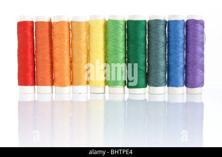 rainbow color spools threads isolated on white background Stock Photo