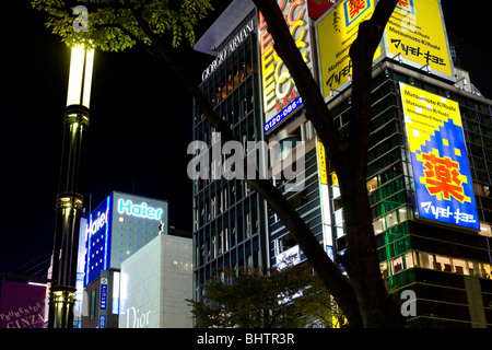 Nightime in the fashionable Ginza area of Tokyo . The district is the location of many designer fashion shops
