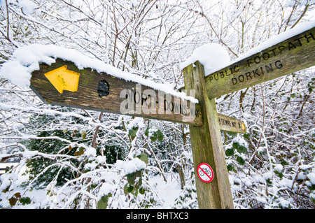 North Downs Way signpost covered with snow, near Dorking, Surrey, UK Stock Photo