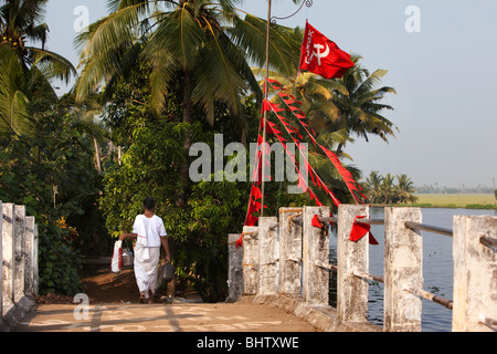 India, Kerala, Alleppey, Alappuzha, Chennamkary Island, KSKTU communist Trade Union Flags on bridge Stock Photo