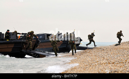 “Royal Marines' beach landing craft, commandos charge onto the beach from their landing craft Stock Photo