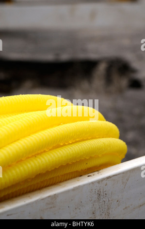 New yellow plastic domestic gas supply pipe. Stock Photo