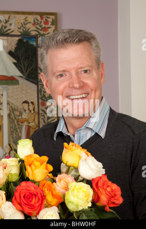 Mature Man and Bouquet of  Roses Stock Photo