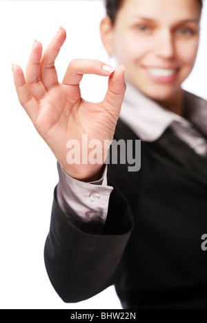 Business woman makes sign 'Ok' by hand. Isolated on a white Stock Photo