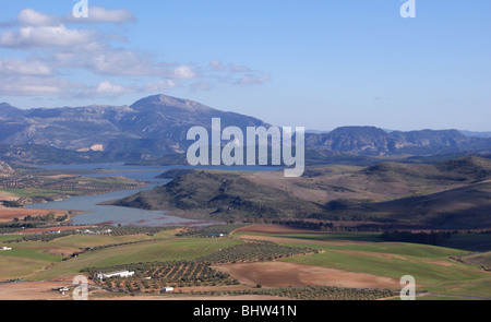 PANORAMIC VIEW FROM TEBA CASTLE AND TOWER ANDALUCIA SPAIN WITH VIEW OF SPANISH LAKE DISTRICT WITH MOUNTAINS IN THE DISTANCE AND FIELDS OF OLIVES Stock Photo