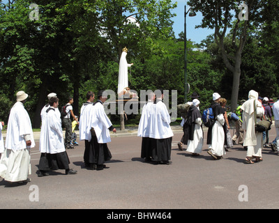 Catholic procession in Bois de Boulogne garden, Paris, France Stock Photo
