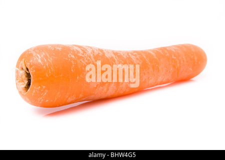 Supermarket friendly washed carrot from low viewpoint against white background. Stock Photo