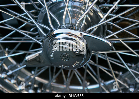 Chrome wire wheel on a classic MGB motor car Stock Photo