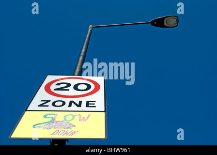 british road sign indicating 20mph zone with illustration of tortoise, in shepherd's bush, west london, england Stock Photo