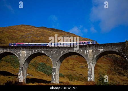 First Scotrail diesel passenger train travelling over Glenfinnan Viaduct, Lochaber, Scotland, UK, Europe Stock Photo