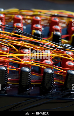Red and black fuses connected with wires ( professional fireworks launching base control ) Stock Photo