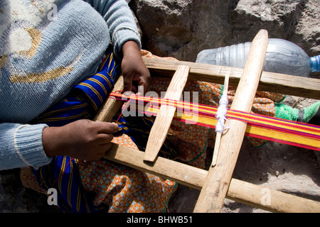 Tarahumara woman weaves cotton in Copper Canyon, Chihuahua State, Mexico. Stock Photo