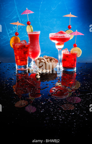 Strawberry Margarita and daiquiri, cosmopolitan on the rocks and Grenadine Fizz with pistachio Stock Photo