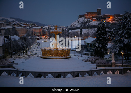 Lourdes covered in snow in winter, by evening, view from the Basilica of the Rosary towards town. Stock Photo