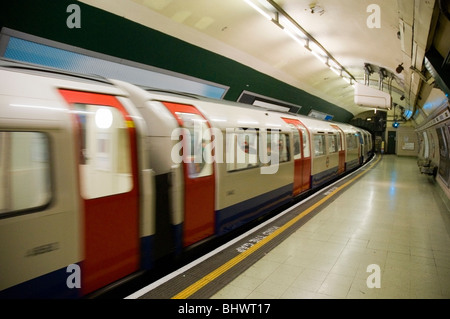 Underground train coming into Paddington tube station, London UK Stock Photo