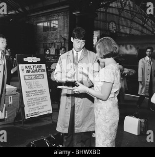 1966 World Cup Tournament in England. Members of the North Korea football team arrive at Lime Street Station in Liverpool by train. Here one player signs an autograph for nineteen year old Jenny Smith. 24th July 1966. Stock Photo