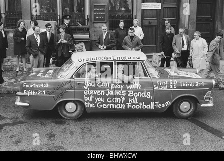 1966 World Cup Tournament in England. A West German car with the message 'You can play with elevewn James Bonds but you can't kill the German football team' in Kensington High Street, the day before the World Cup Final. 30th July 1966. Stock Photo