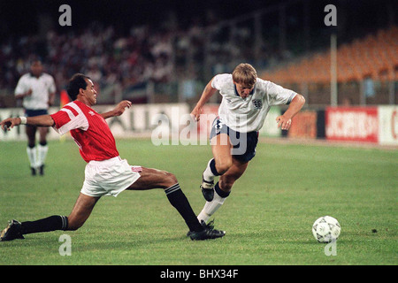 World Cup 1990 Group F England 1 Egypt 0 Stuart Pearce (white) uses ability to see his way passed a challenge by Egyptian player Stock Photo