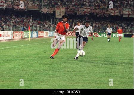 World cup 1990 Group F England 0 Holland 0 John Barnes and Ruud Gullit both chase for the ball. Stock Photo