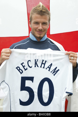 David Beckham, May 2002 The England football captain is photographed draped with the cross of St George on Awaji Island, Japan Holding up his 'Beckham 50' shirt Stock Photo