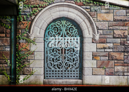 A trompe l’oiel bronze gate painted on a wall of the Community Bridge, Frederick, Maryland. Stock Photo