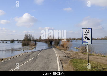 Think don't Sink warning at a flooded A1101 road at Welney wash, Norfolk, England UK Stock Photo