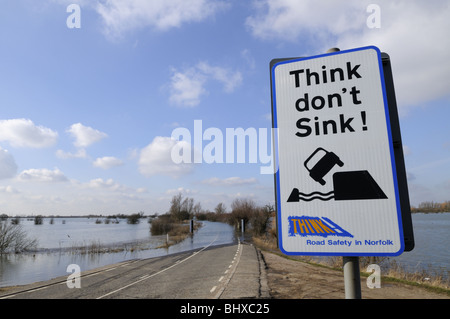 Think Don't Sink warning sign by a flooded A1101 at Welney Wash, Norfolk, England UK Stock Photo