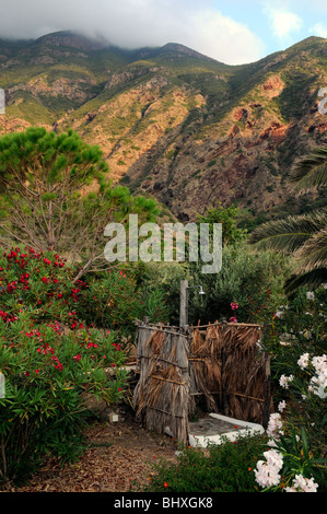 An outdoor garden shower in the backyard of a home, in the village of Pollara, on the island of Salina, Aeolian Islands, Sicily, Italy. Stock Photo