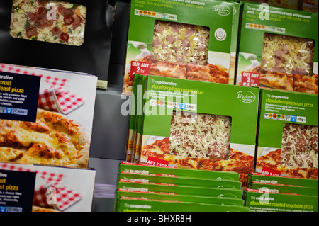 Boxes of pizza on sale on the shelves, Co-Operative Co-Op supermarket, UK Stock Photo