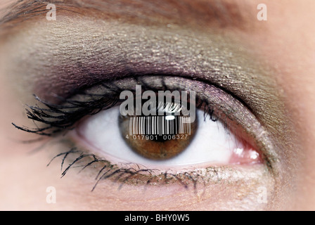 bar code is reflected in the brown eyes of a woman Stock Photo