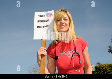 Private healthcare in the USA must go female protester Stock Photo