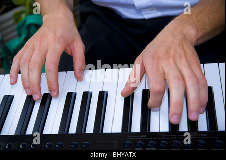 Hands playing piano Stock Photo