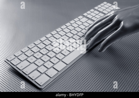 computer keyboard aluminum gray hand silver background Stock Photo