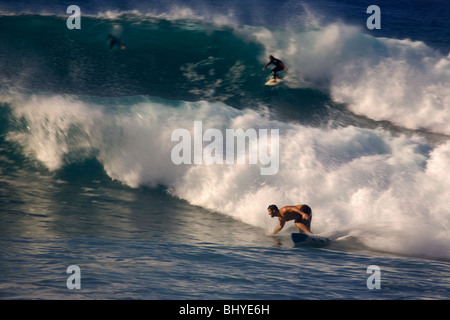 Surfers on the waves at El lloret break in Las Palmas de Gran Canaria Stock Photo