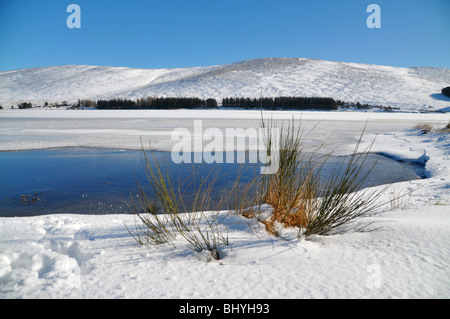 Scottish winter scene of  frozen Backwater Reservoir, Angus, Glen Isla. Stock Photo