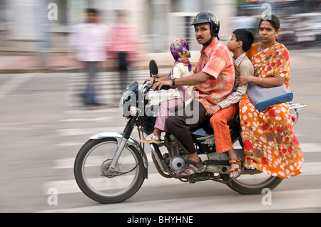 Indian family riding on their motorcycle. Bangalore, India Stock Photo