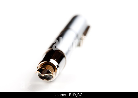 Pen with a gold feather isolated on a white background Stock Photo