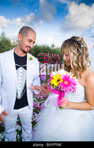 Bride and groom exchanging wedding rings at wedding Stock Photo