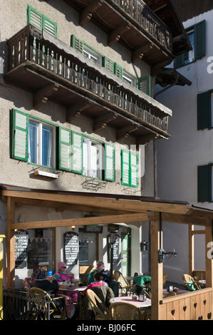 Cafe in the village centre, Campitello, Val di Fassa, Dolomites, Italy Stock Photo
