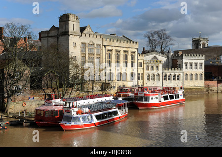 Boats moored on the River Ouse at Lendal Bridge City of York in North Yorkshire England Uk Stock Photo