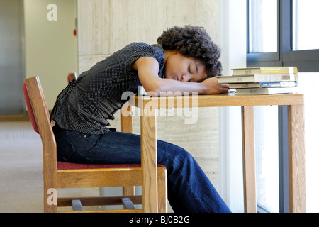 Student fell asleep in library Stock Photo