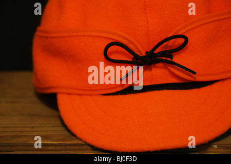 close up still life stormy kromer orange blaze hat Stock Photo