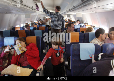 Passengers on an aeroplane Stock Photo