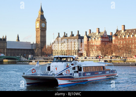 Thames Clipper at Waterloo Pier and Houses of Parliament Stock Photo