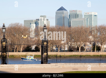 View from gardens of Royal Naval College, Greenwich, London to Canary Wharf with police boat on River Thames Stock Photo