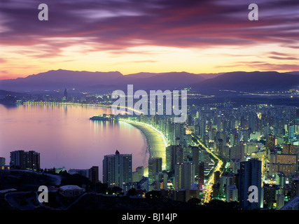 View over Playa de Levante and Playa de Poniente at sunset Stock Photo