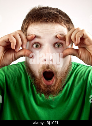 Wow surprise concept - amazed mime looking man Stock Photo