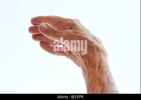 Senior woman's hand isolated on white Stock Photo